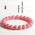 Women's red rhodochrosite crystal bracelet with geometric design and longevity lock fastening