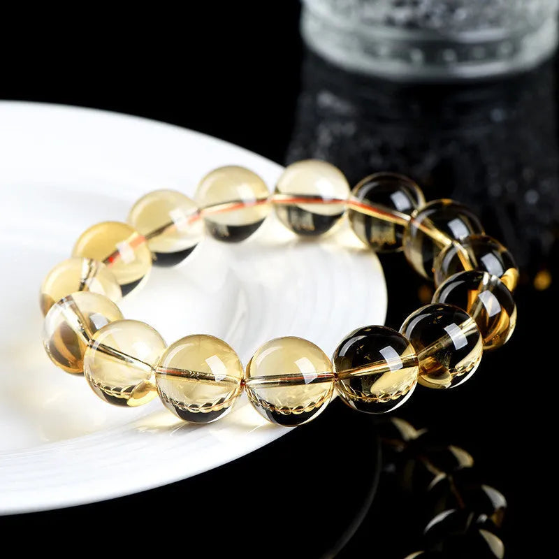 Natural citrine scattered beads ball bracelet showing polished gemstone beads on a wrist.