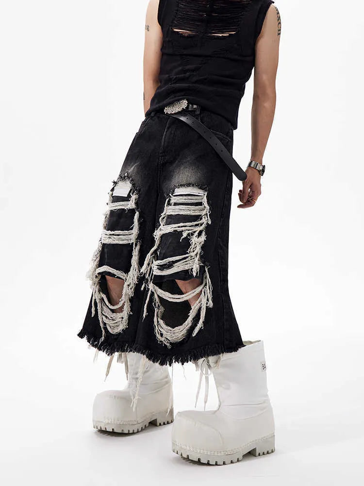 Black women's cropped wide leg jeans with mid-high waist and ripped patch detail