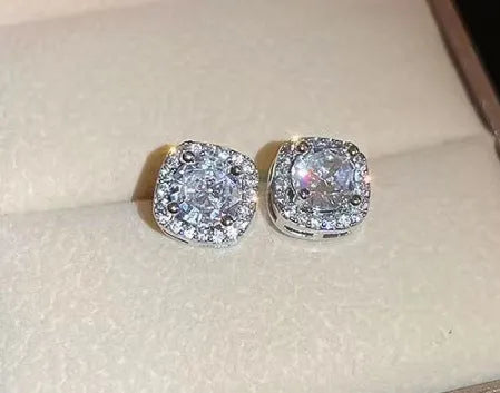 A pair of square-shaped diamond-treated alloy earrings on a white background, showing silver and gold colour options.