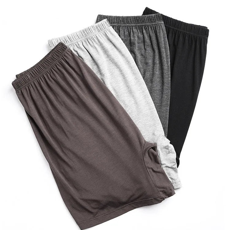 Men's solid colour modal boxers showing high waist design available in black, blue, gray and brown