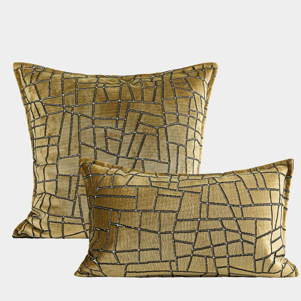 Tuhao gold geometric abstract pattern on a square decorative cushion with tassel detail.