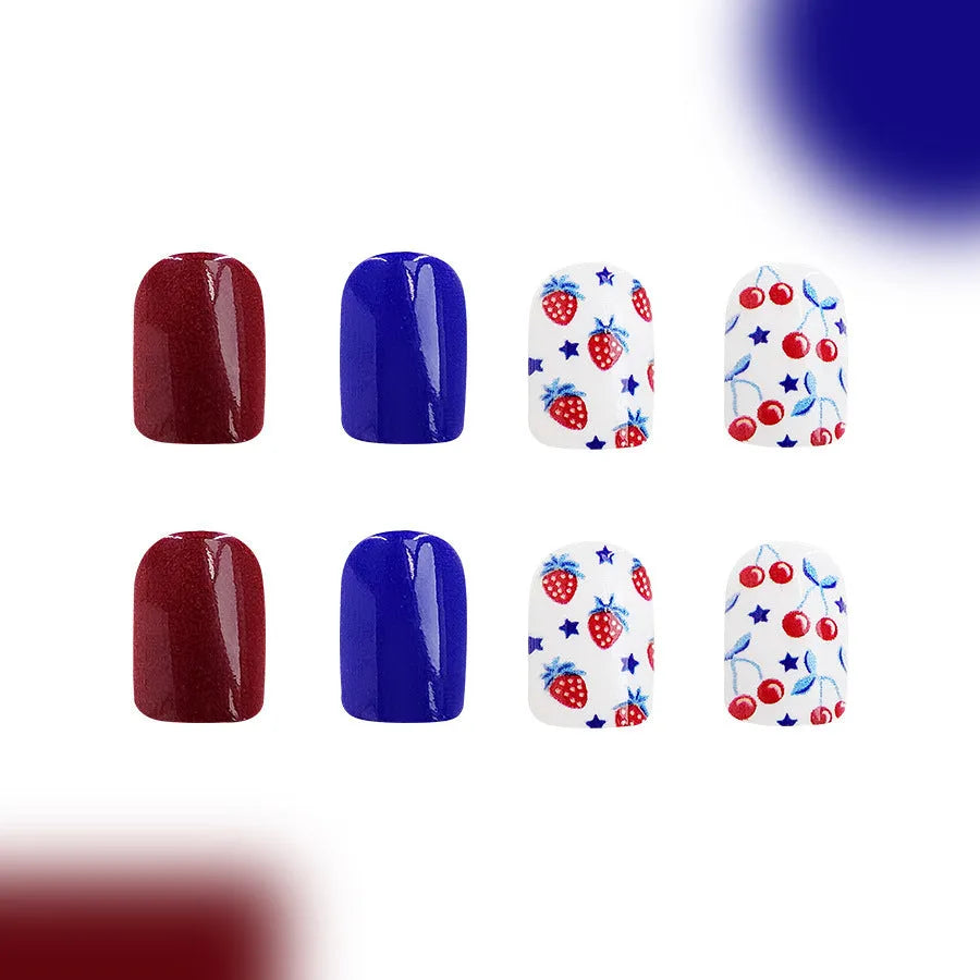 Short glossy false nails with red and blue strawberry and cherry Independence Day design