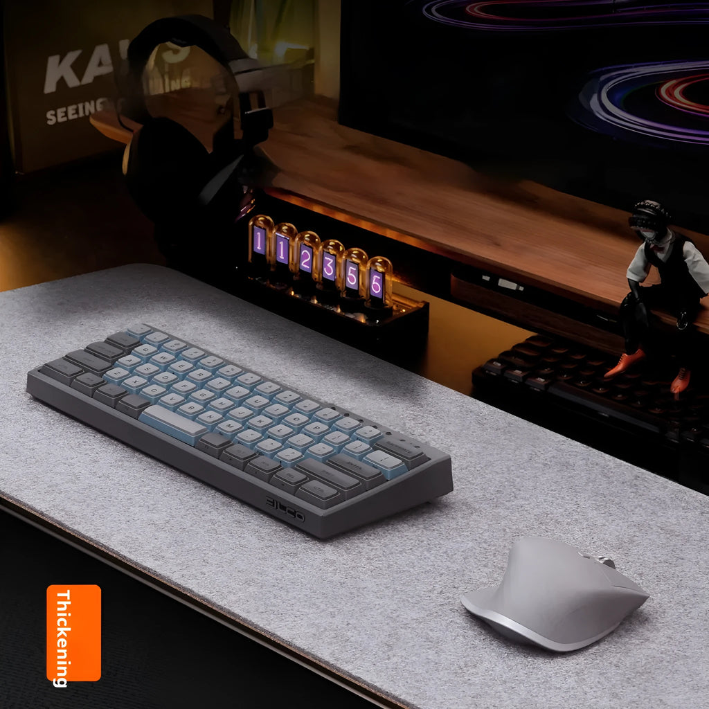 Oversized black grey felt and cork mouse mat on office desk with non-slip backing