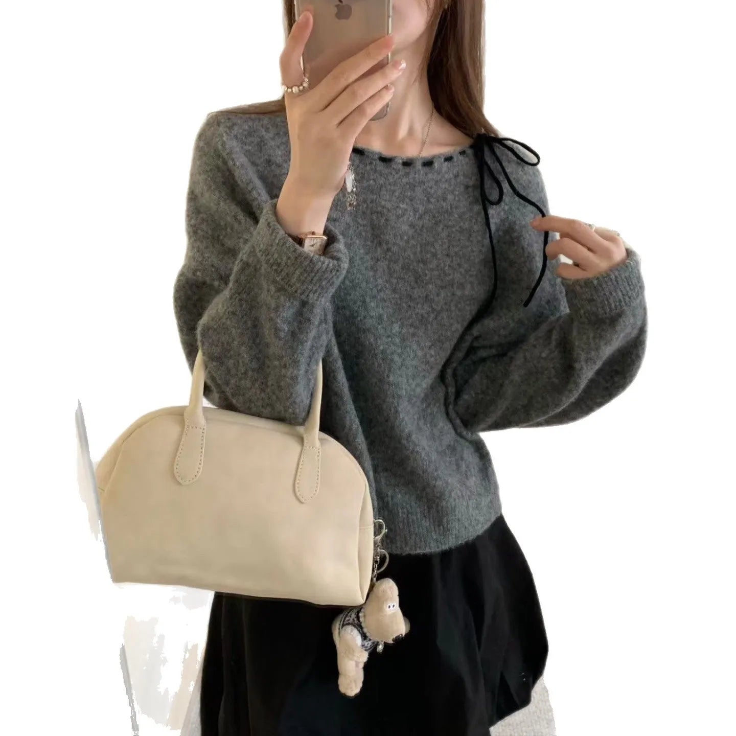 Grey loose-fitting women's knitwear pullover on a hanger