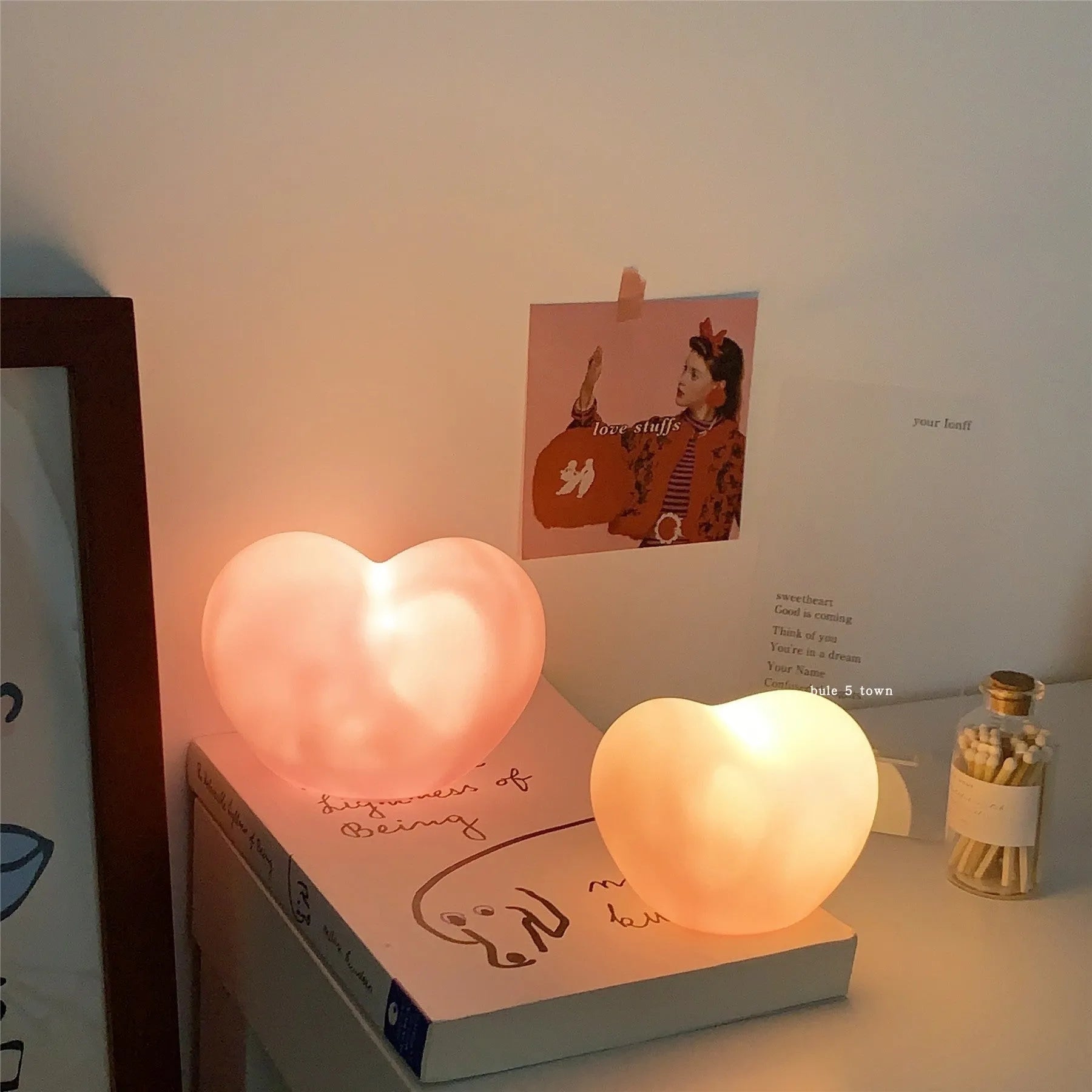 White or pink vinyl atmosphere lamp in trumpet or tuba design with warm glowing light