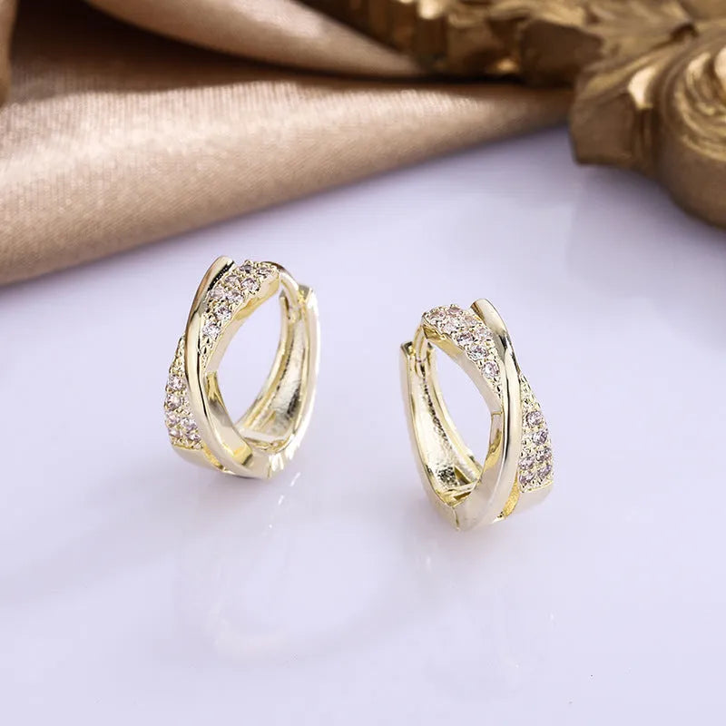 Geometric copper hoop earrings with zircon detailing in 14K yellow colour