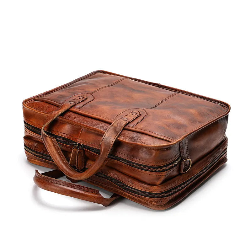 Large vintage leather men's briefcase with internal computer and camera pockets measuring 42cm wide