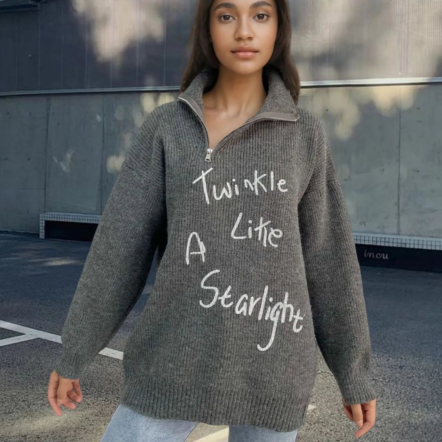 Women's grey alpaca wool pullover sweater with turtleneck, loose lapels, and an oblique diagonal zipper.