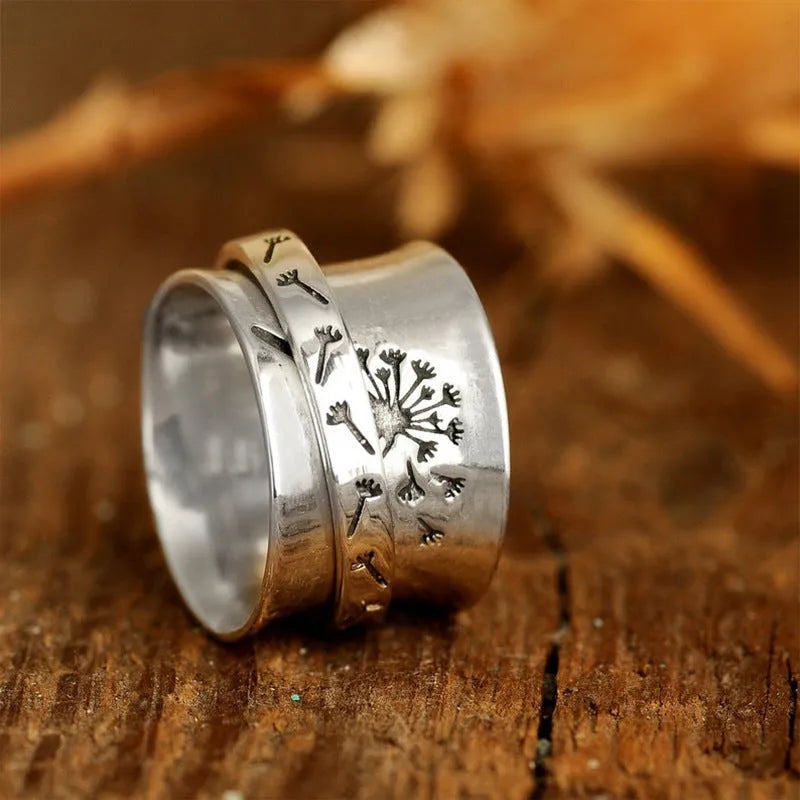 Silver rotatable flower ring with adjustable floral element and electroplated alloy construction