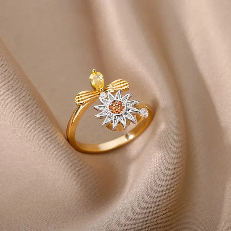 Copper rotatable decompression ring with adjustable opening in gold electroplated finish