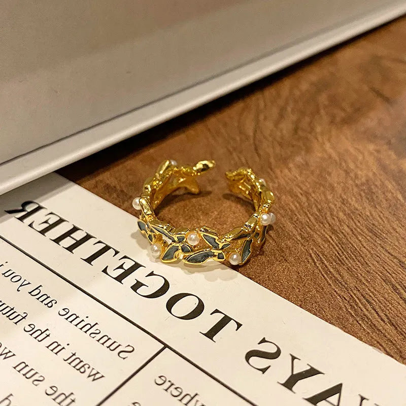 Copper Chinese butterfly women's ring showing creative design with oil dripping treatment finish