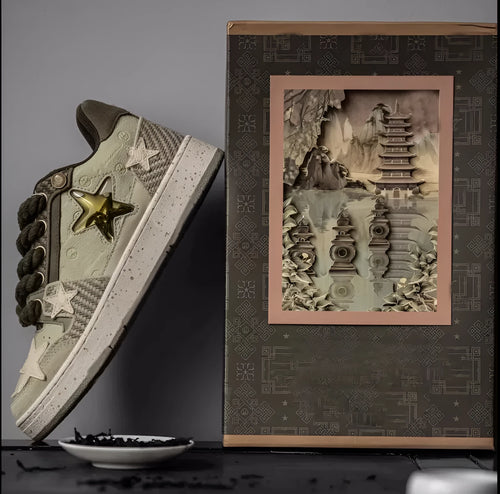 Green low-top casual sneakers with star pattern design on multi-material upper and rubber sole