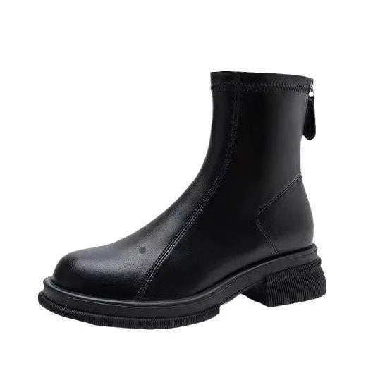 Black women's flat-heel ankle boots with a round toe and back zipper on a white background