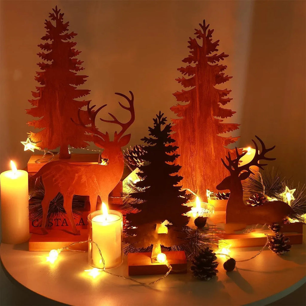 Three rustic metal Christmas tree ornaments with elk motifs in aged metallic finish
