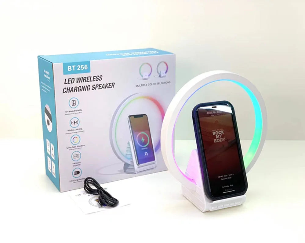 White circular smart Bluetooth speaker with wireless charging pad and ambient light, 225mm diameter