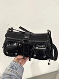 Black PU leather underarm baguette bag with adjustable shoulder strap shown in crossbody position