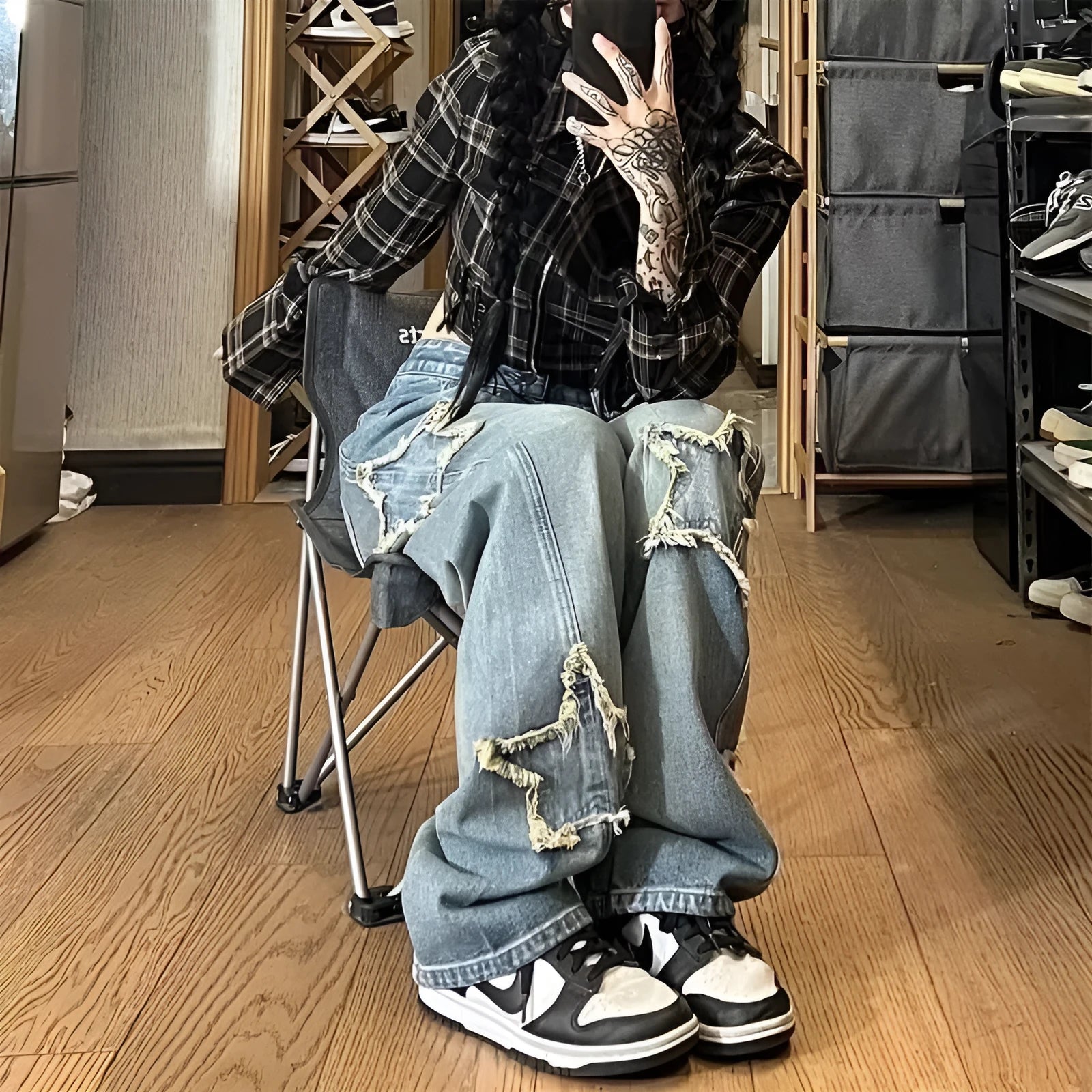 Blue wide-leg high-waist denim trousers with straight leg design laid flat