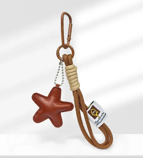 Handmade soda bread style handbag pendant charm with cartoon design and brown strap