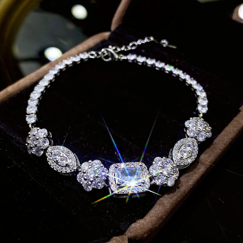 Women's white gold plated geometric bracelet with zircon stones in two length options.