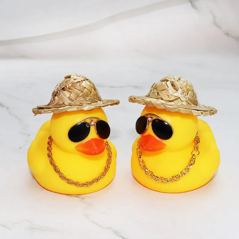 Yellow duck car dashboard ornament with straw hat, matte finish, and included adhesive base with sunglasses necklace