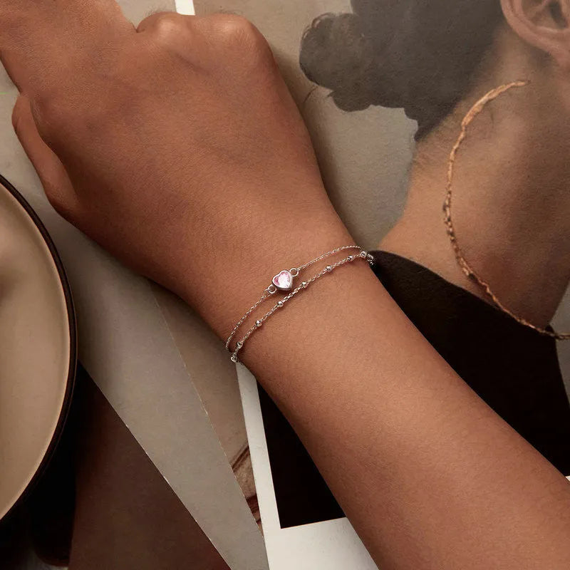 Women's sweet style 925 sterling silver bracelet with a small heart pendant on an adjustable chain.