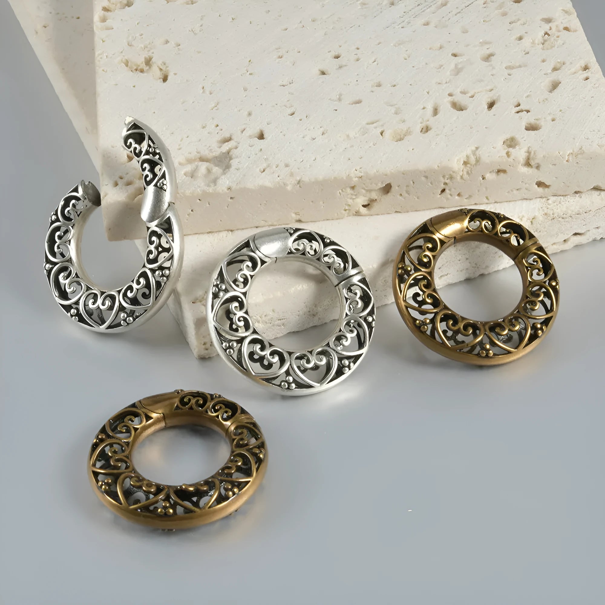 Retro heart-shaped hollow lotus magnetic earrings in stainless steel with antique finishes