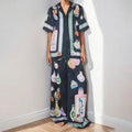 Black women's cardigan and pants set with cartoon animation pattern