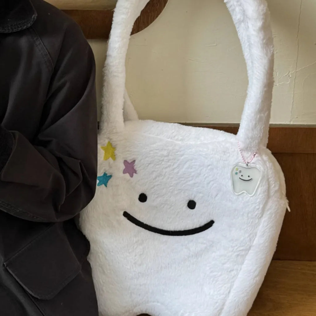 White plush shoulder tote bag with cute tooth design and zipper closure