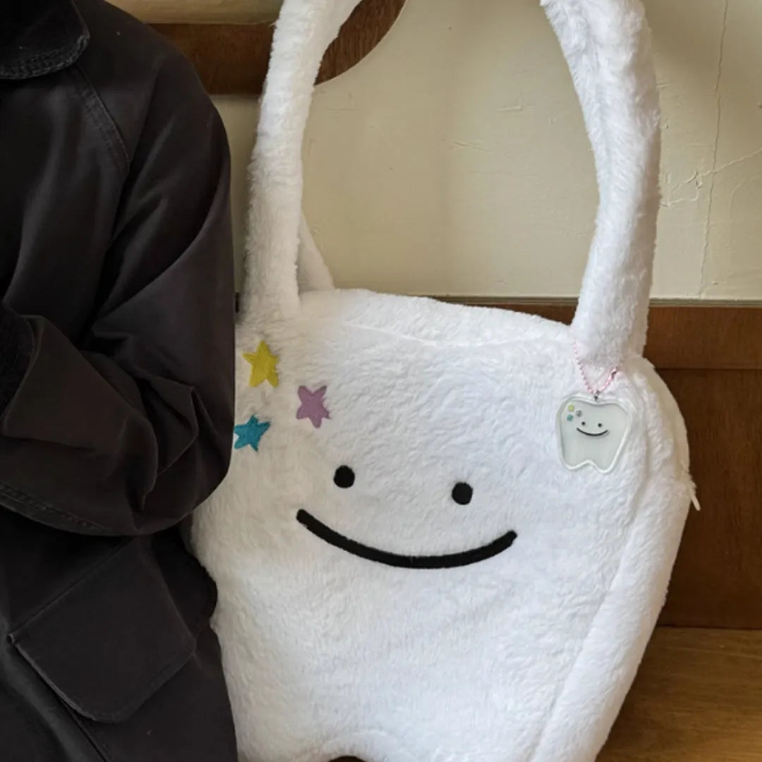 White plush shoulder tote bag with cute tooth design and zipper closure