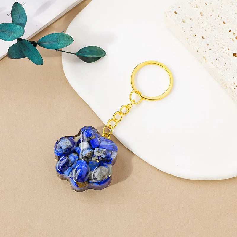 Natural crystal cat's paw keychain pendant charm in one of ten crystal types including pink crystal and amethyst.
