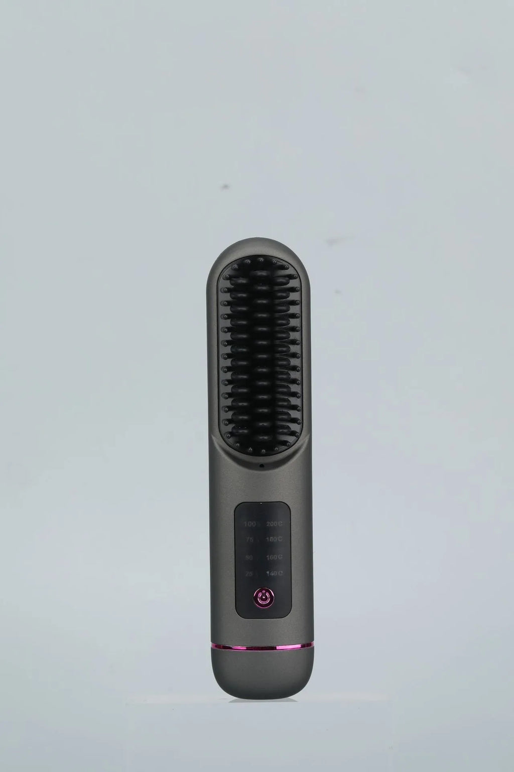 A white portable negative ion hair comb with USB charging port on a dark surface.