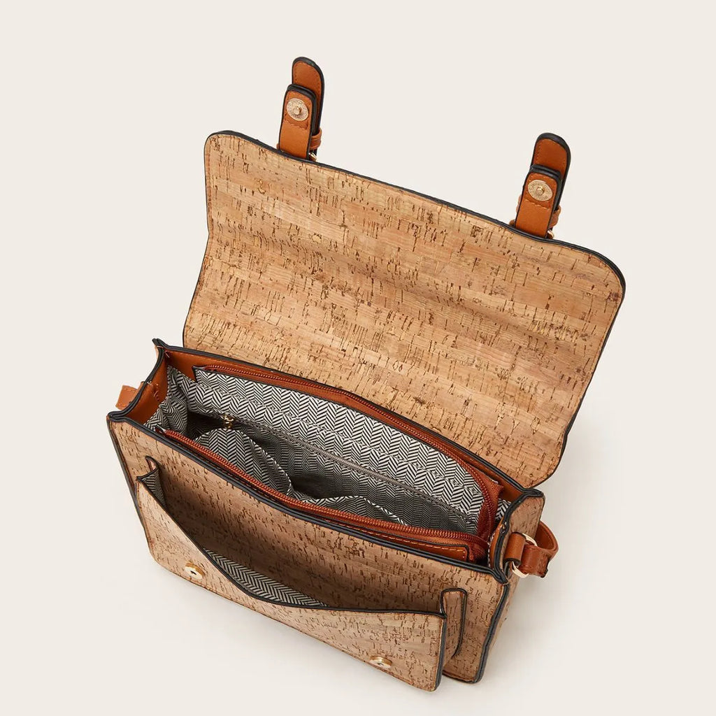 Women's large crossbody bag in a printed PU material with a single shoulder strap.