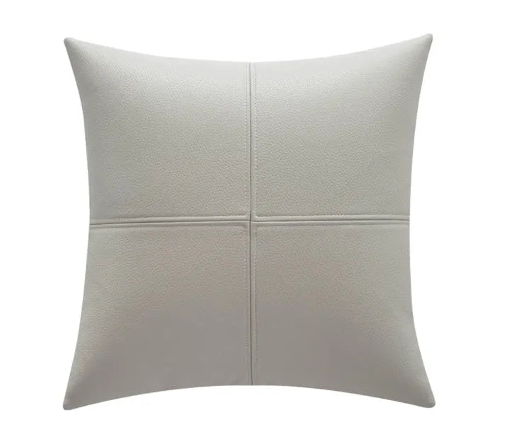 Solid colour soft cowhide leather pillow cover in Nordic style on a grey sofa.