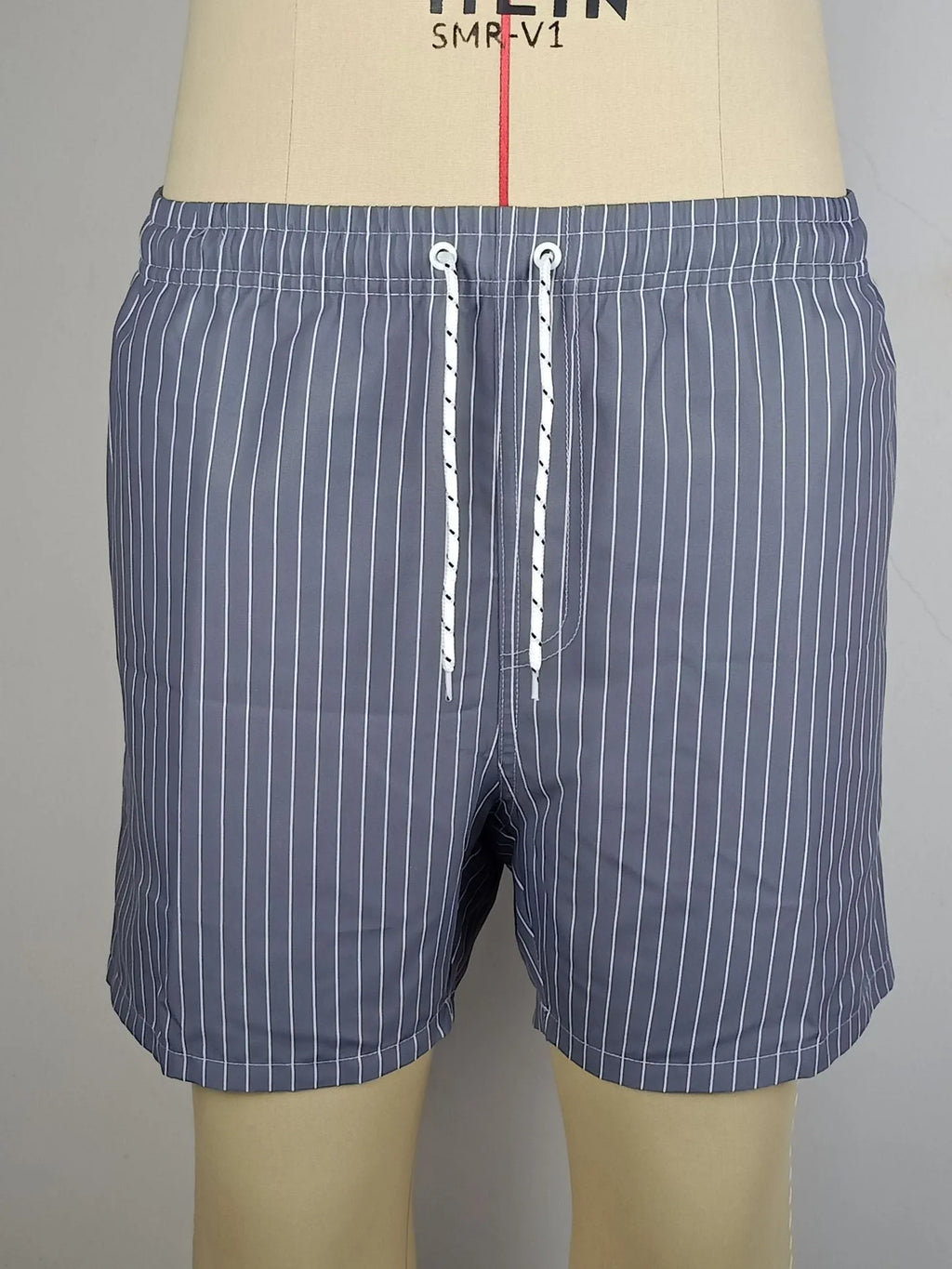 Polyester fibre striped beach shorts with straight leg opening and triangle lining design in multiple colours