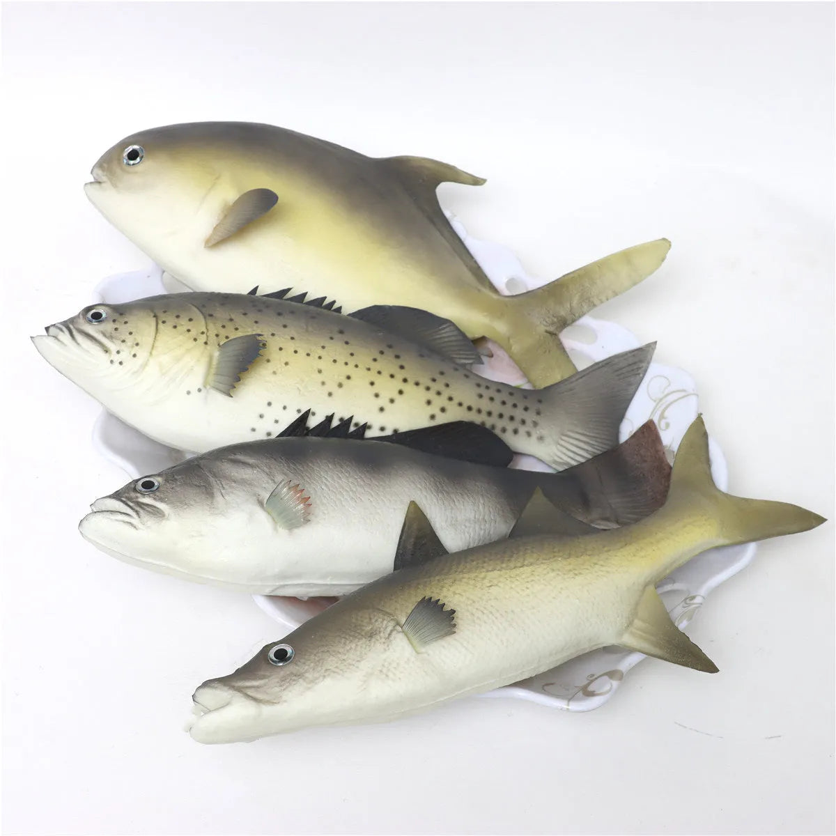 Three PU simulated fish models showing yellow-fin tuna variations on display surface