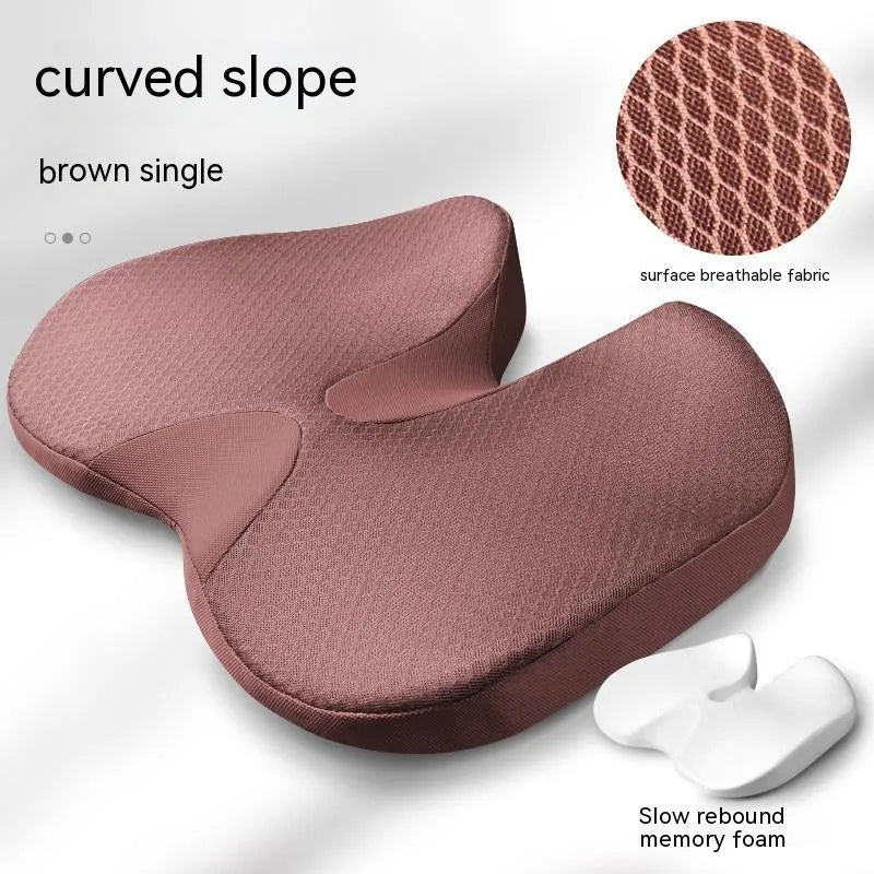 Curved memory foam seat cushion in beige for tailbone and back support