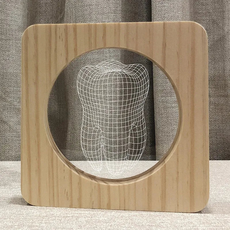 Tooth shaped wooden colour acrylic night lamp with USB cable on a table