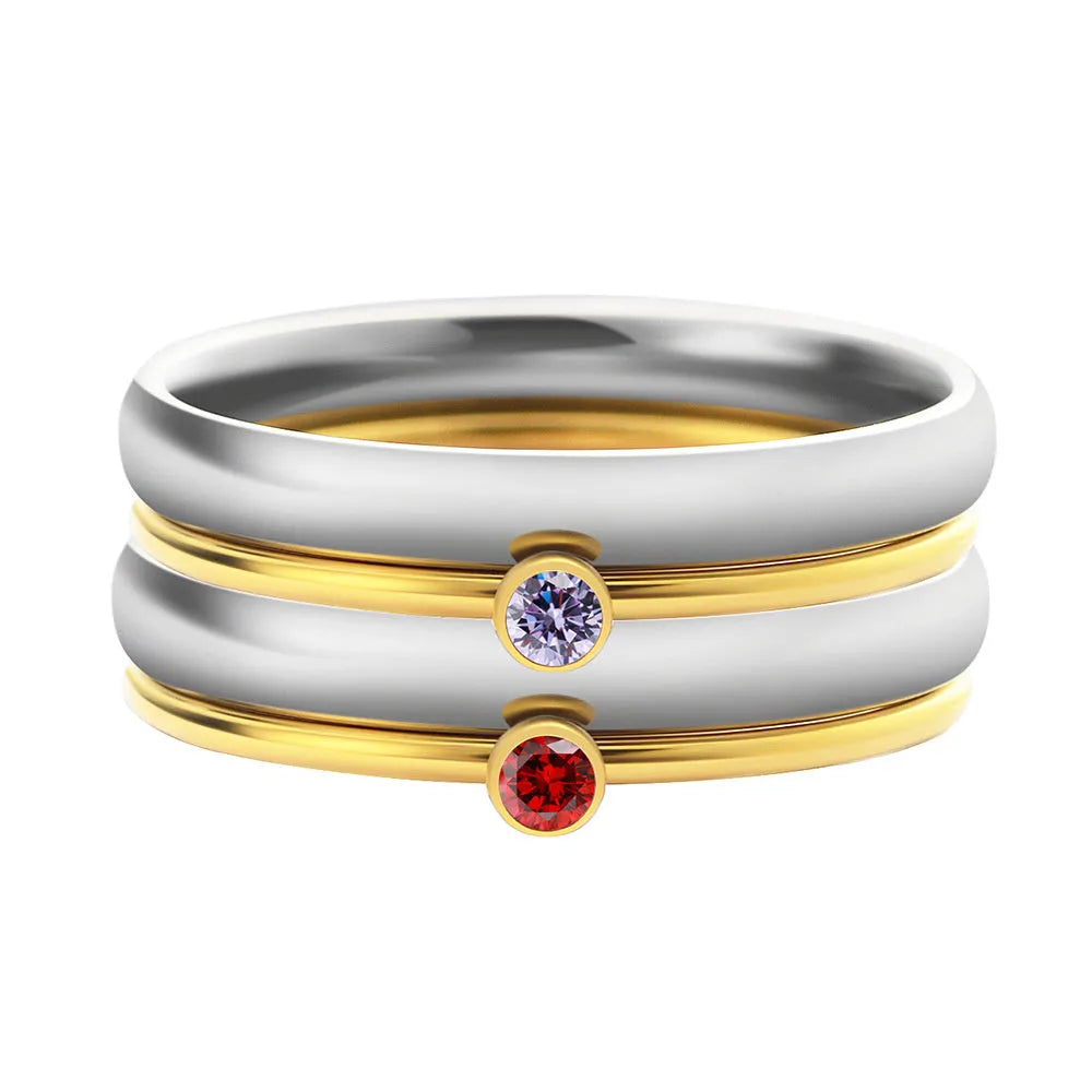 Close-up of a geometric engraved December birthstone ring in gold electroplate on titanium steel.