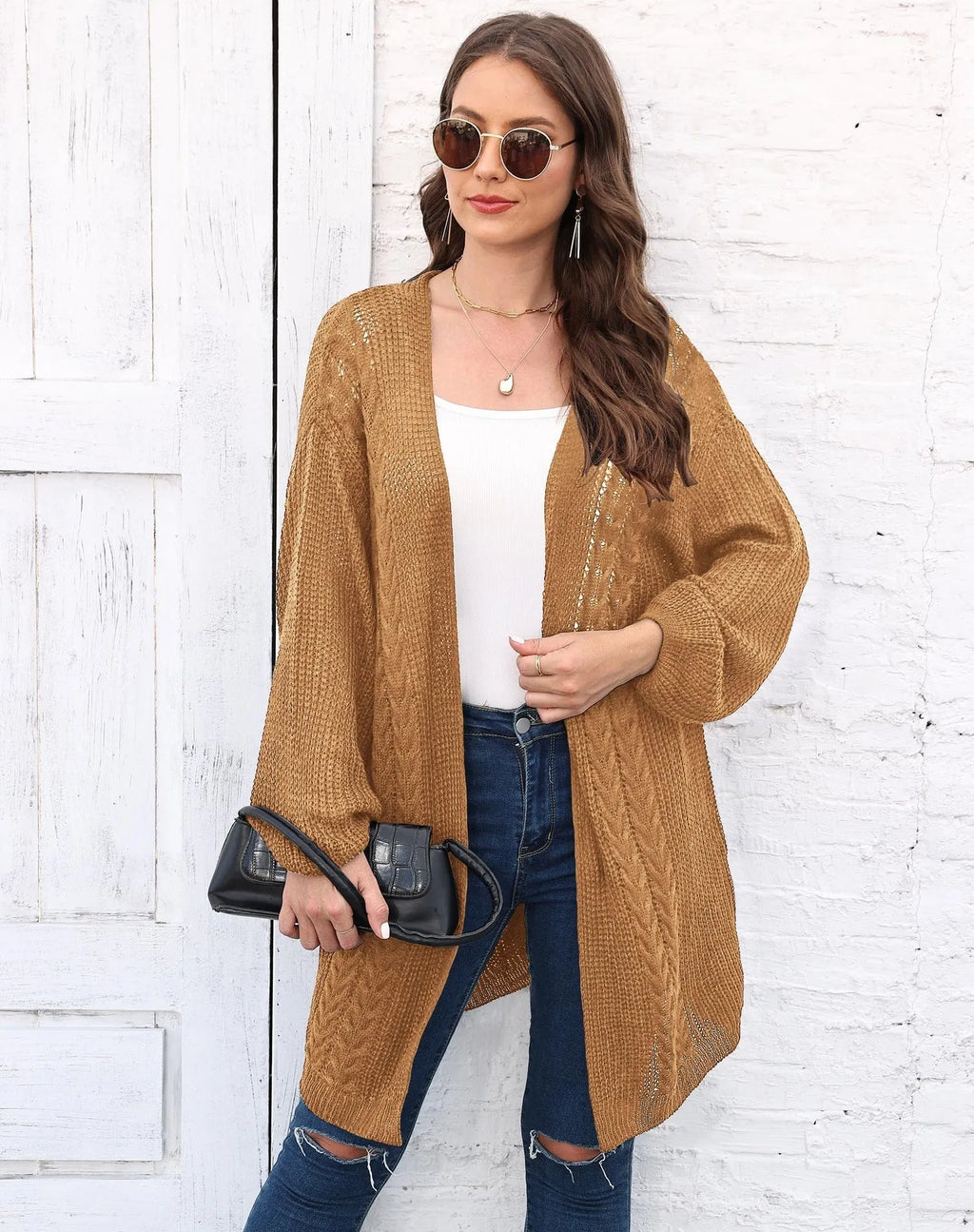 Women's loose acrylic sweater coat in army green, shown as a layering piece.