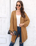 Women's loose acrylic sweater coat in army green, shown as a layering piece.