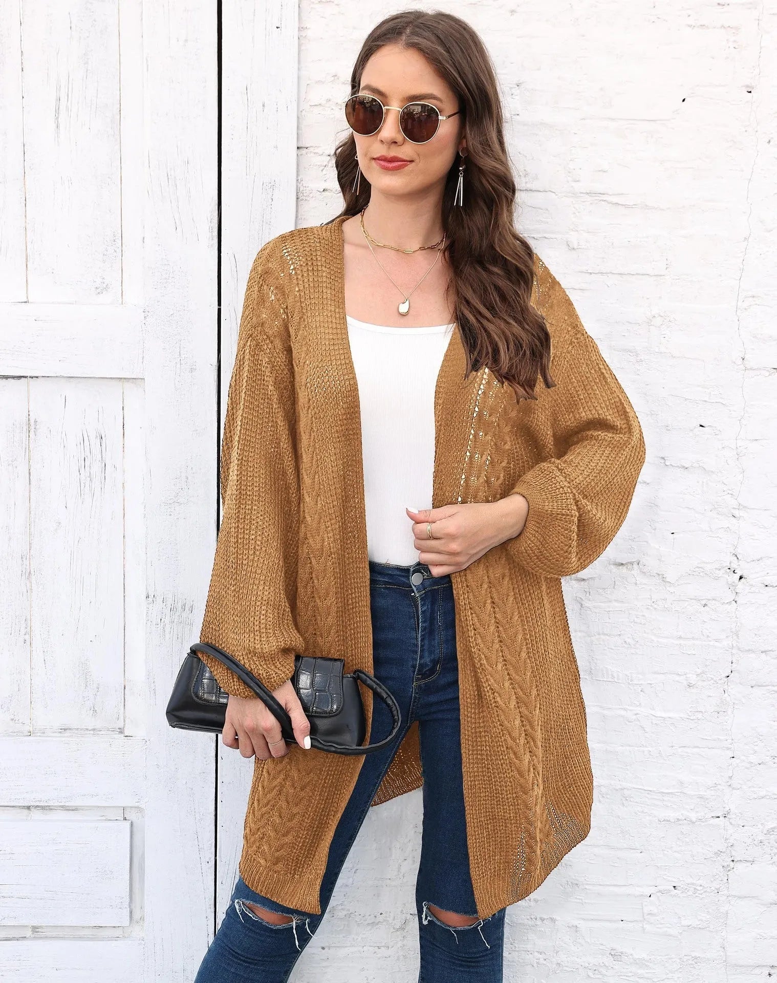 Women's loose acrylic sweater coat in army green, shown as a layering piece.