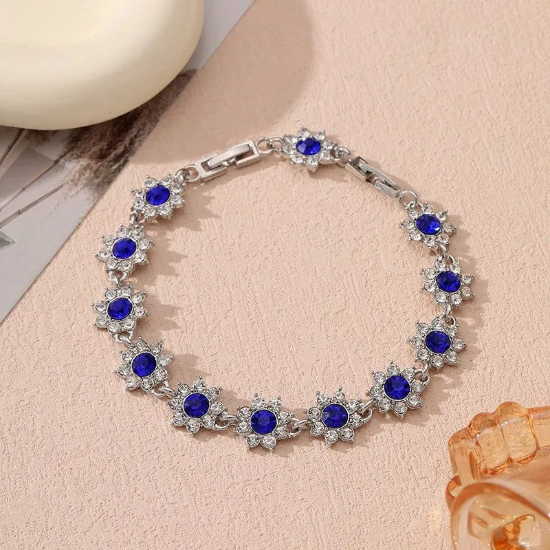 Zinc alloy flower bracelet with electroplated colour finish and colourful crystal decorations in gold and silver variations
