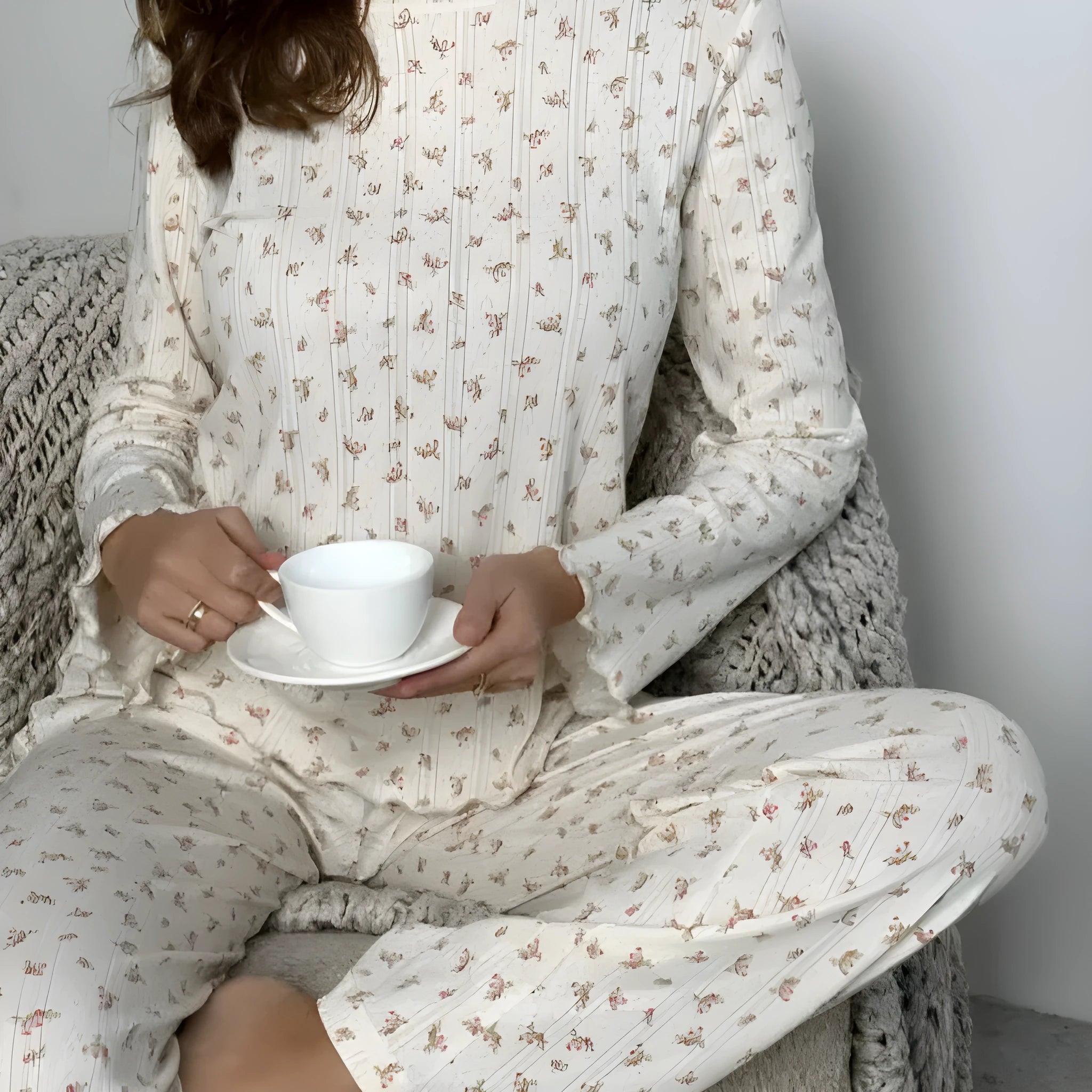 White floral print women's lounge set with bell sleeve top and wide leg trousers
