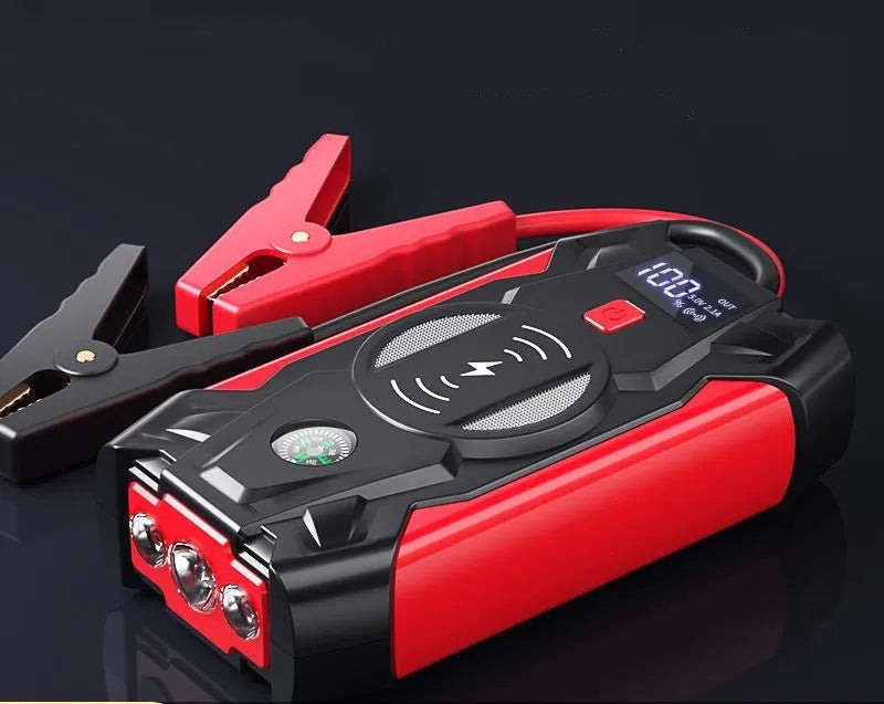 Red car jump starter with digital display and air pump accessory for 12V battery emergency starting