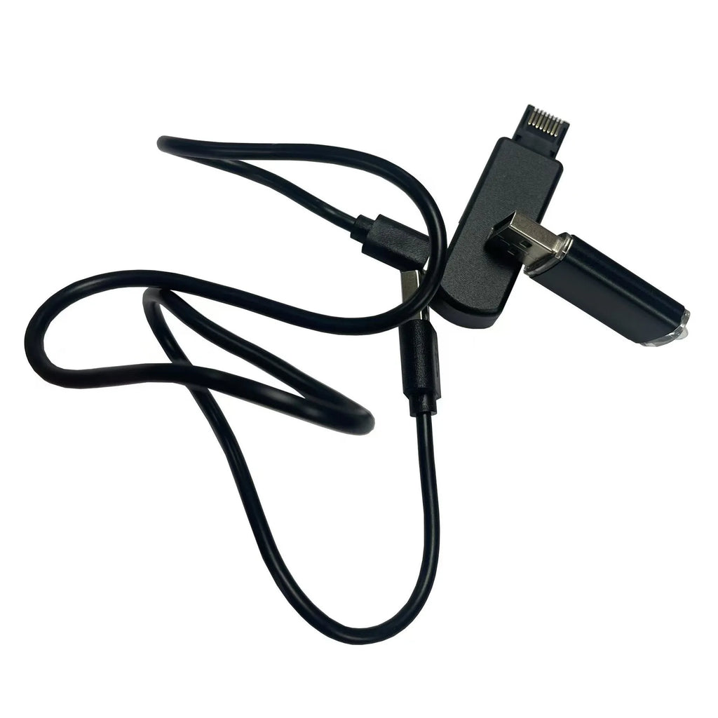 Black aluminium alloy PS4 USB firmware tool with data cable on a dark surface.