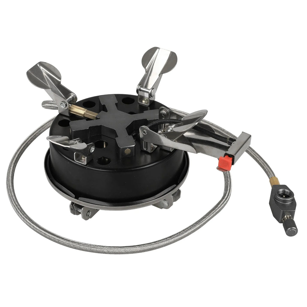 Silver portable folding camping gas stove made of stainless steel and copper with a long black hose.