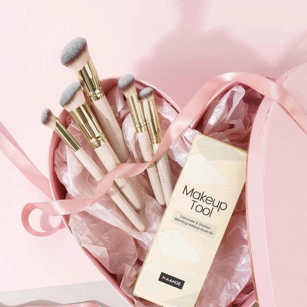 Five apricot coloured makeup brushes with synthetic bristles including angled blusher brush