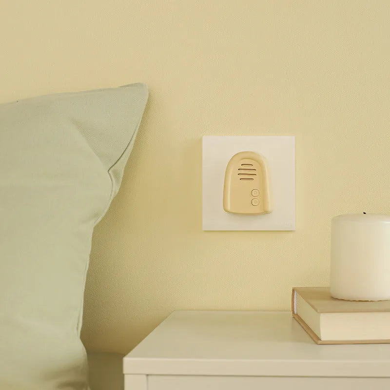 Household wireless plug-in beeper doorbell in milky yellow or white colour