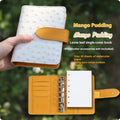 A7 format loose-leaf watercolour notebook in green, shown open on a page with a watercolour wash.